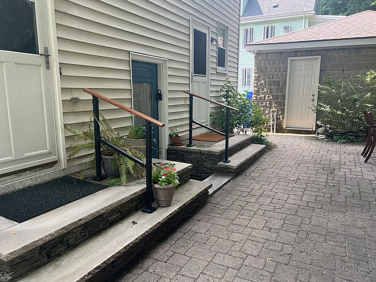 back yard with back door entrance from driveway with space for 1 car