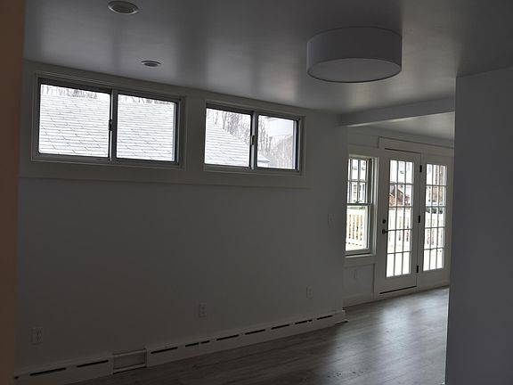Small living room connected to kitchen.
