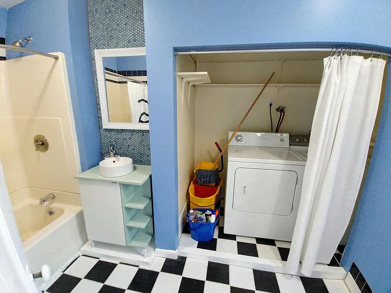 Laundry closet in bathroom area