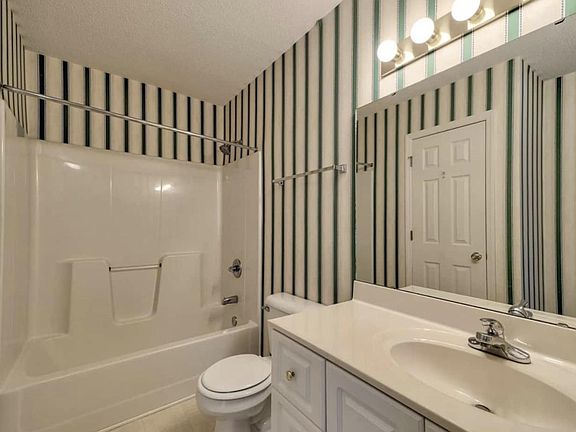 Large guest bathroom with linen closet.