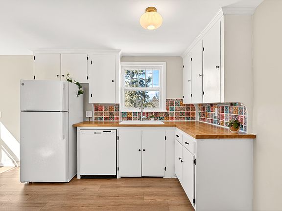 Lovely refinished kitchen with new appliances and butcher block counters.