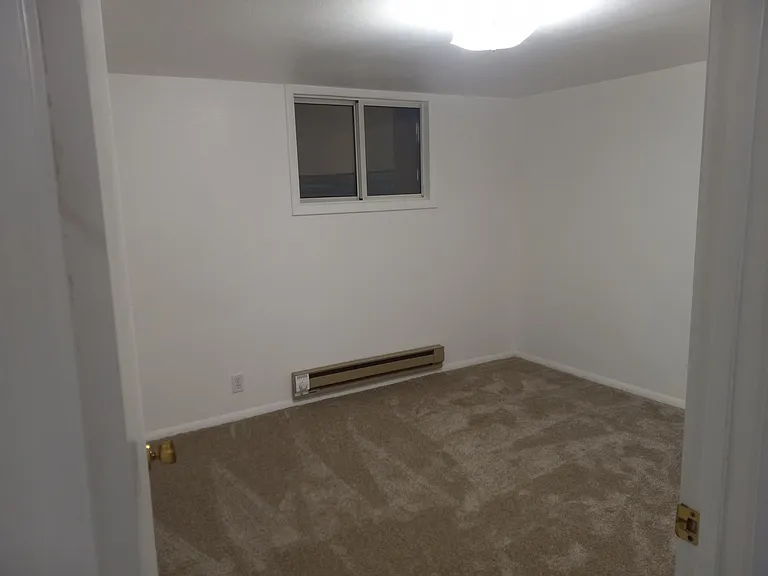 View #1 of second bedroom. Ample space for queen size bed or bunk beds. Plenty of space for dressers and other furniture
