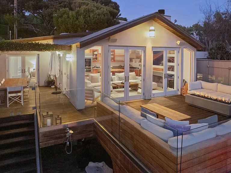 Plenty of outdoor seating on a large beachfront deck.