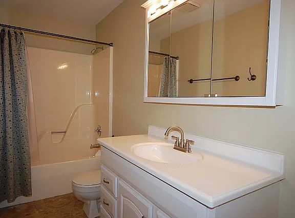 Bedroom shared bathroom. Not pictured: Updated walk-in shower with glass sliding doors.