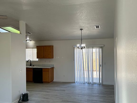 open kitchen, dining room, living room area, opening to back patio