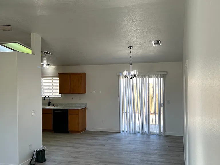open kitchen, dining room, living room area, opening to back patio