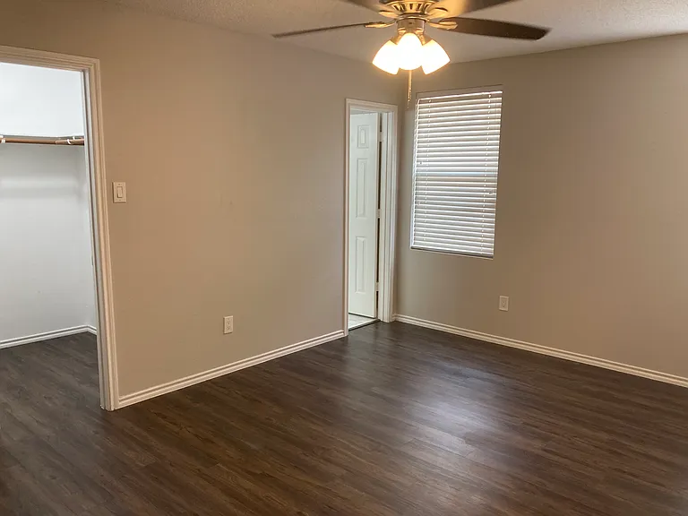 Master bedroom. Closet on left and door to private bath on right