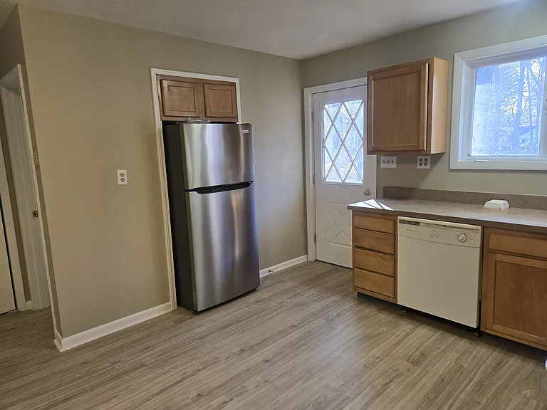 Door to small back patio
(White dishwasher being replaced today with new SS)