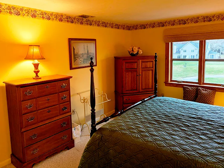 master bedroom, ample storage, casement (crank-open) windows, view of fairways