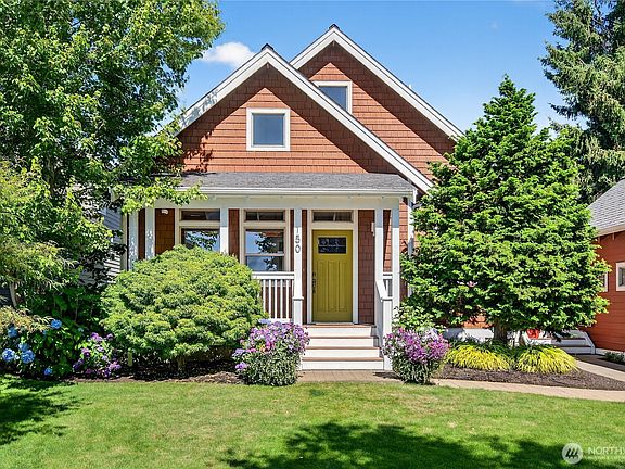 Beautiful entry onto front porch with mature landscape>