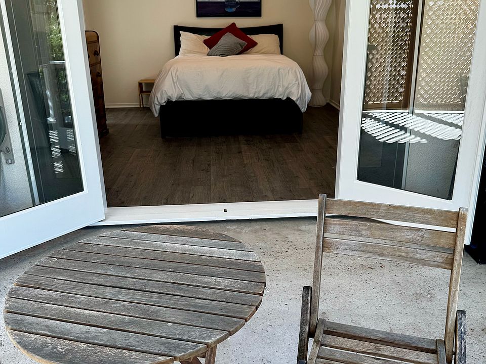 french doors open from bedroom onto private deck