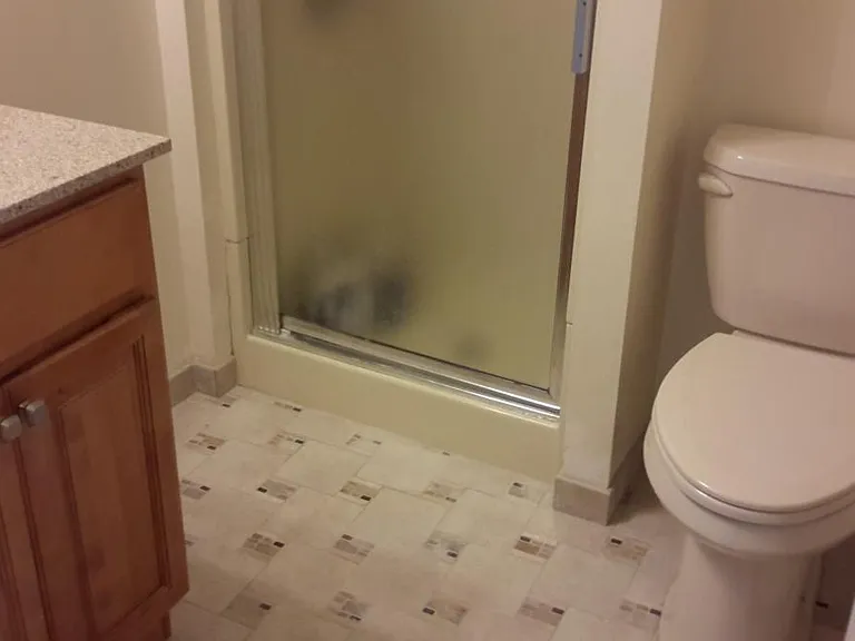 Bathroom w/maple cabinetry and ceramic tile flooring