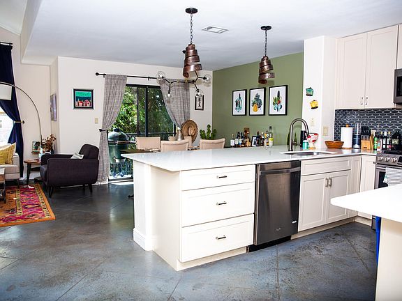 Open kitchen, dining, and living area.