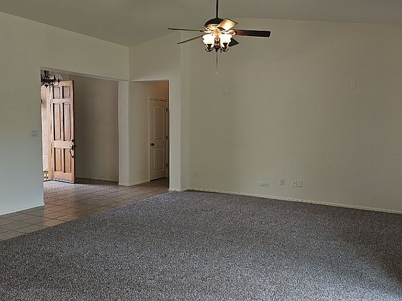 Living room to entry, new carpet, new paint.