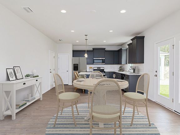 Enjoy a lovely, casual dining experience in your brand new construction home. - Model Representation