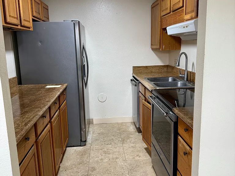 kitchen with stove, fridge and dishwasher