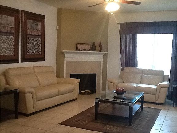 Living Room with Fireplace (large window with view to back yard)