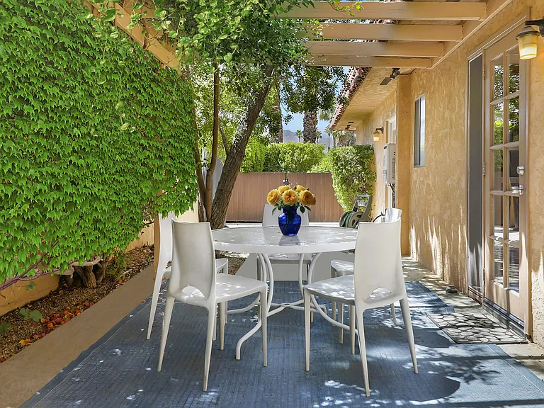 Private patio, perfect for computer time or relaxing with a book in this lush retreat!