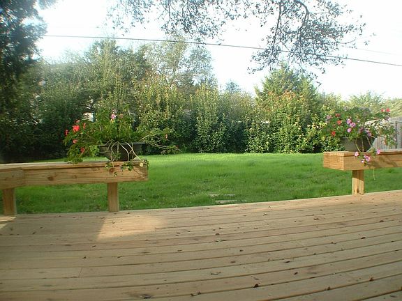 Private back yard with relaxing deck and built in seating