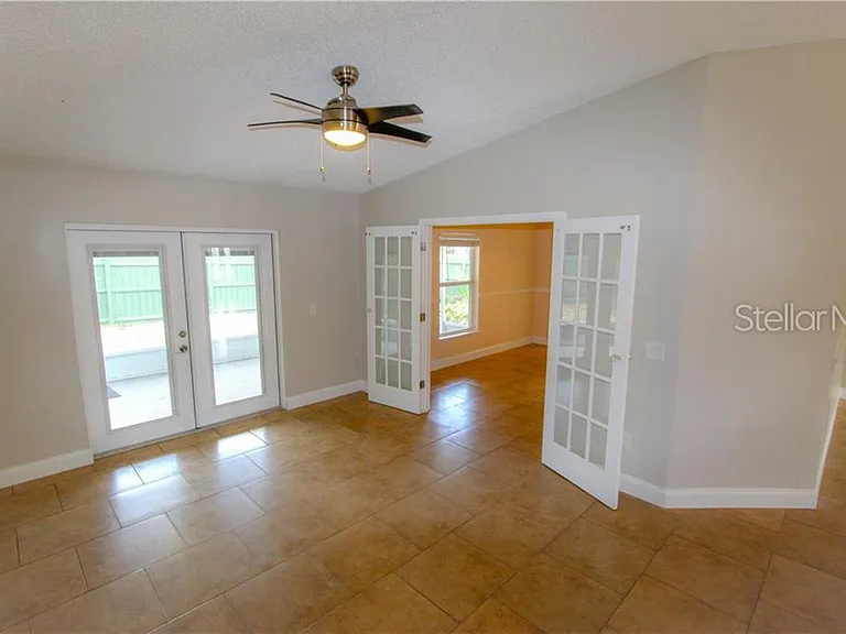 Dining Area with Doors to Primary Bedroom