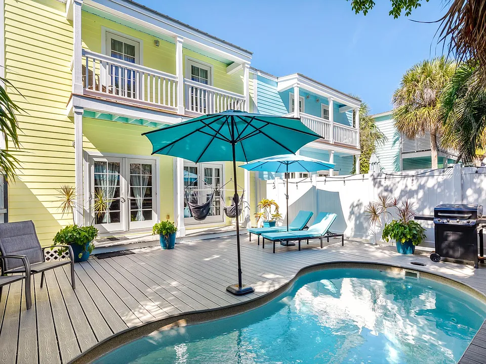 Private heated pool with grill and lounge area