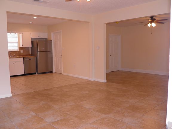 View from Entry. Home is fully tiled with NO CARPET.