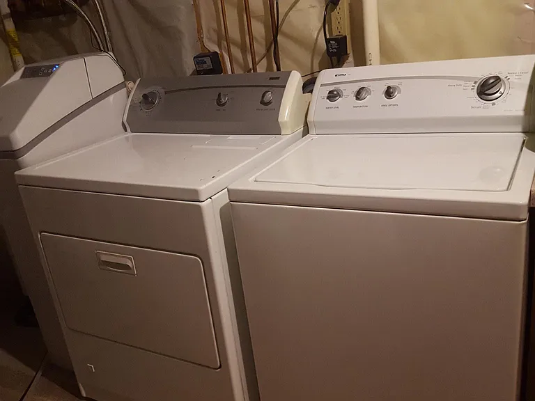 Utility room with clothes washer/dryer and new water softner