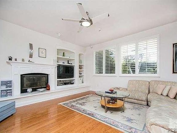 Cozy Family room with fireplace media center and this is open to the open light and brite kitchen