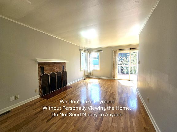 Large living room. Fireplace is inoperable.