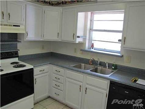 Newly painted cabinets with efficient kitchen