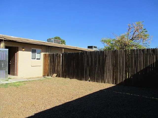 larger back yard and gate to street, fenced.