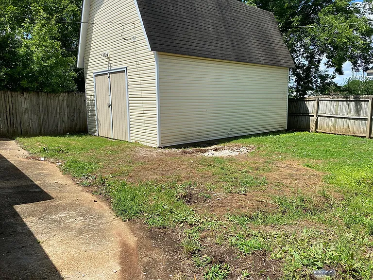 Large "barn style" storage, workshop with attic storage in private backyard. Fenced yard for pets.