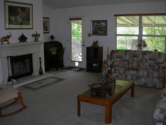 Huge Family Room with Fireplace features 2" faux wood blinds