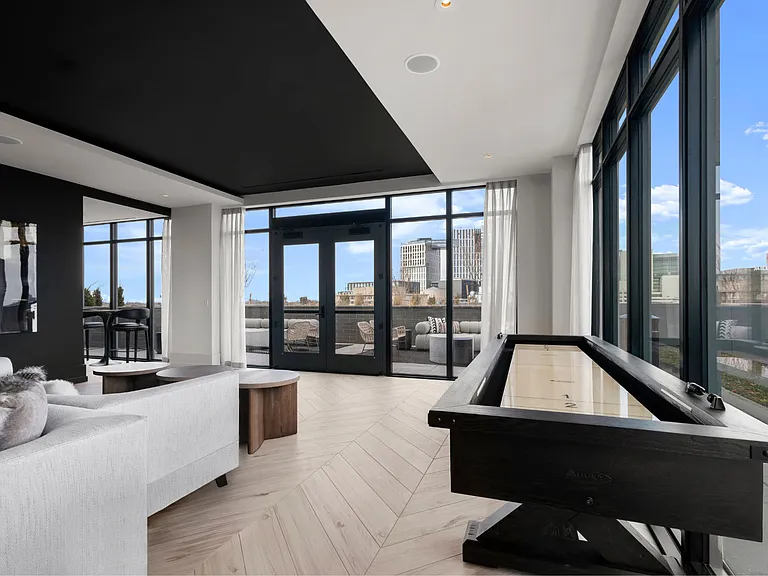 Relax, play, and unwind in a light-filled social space