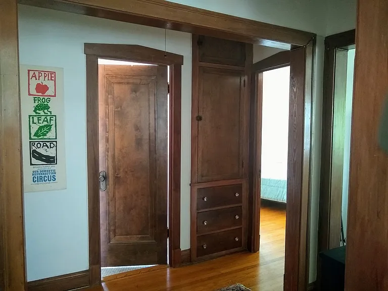 Hall, bathroom door, room for rent to the right
