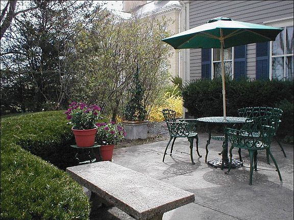 Front terrace overlooks historic buildings and grounds