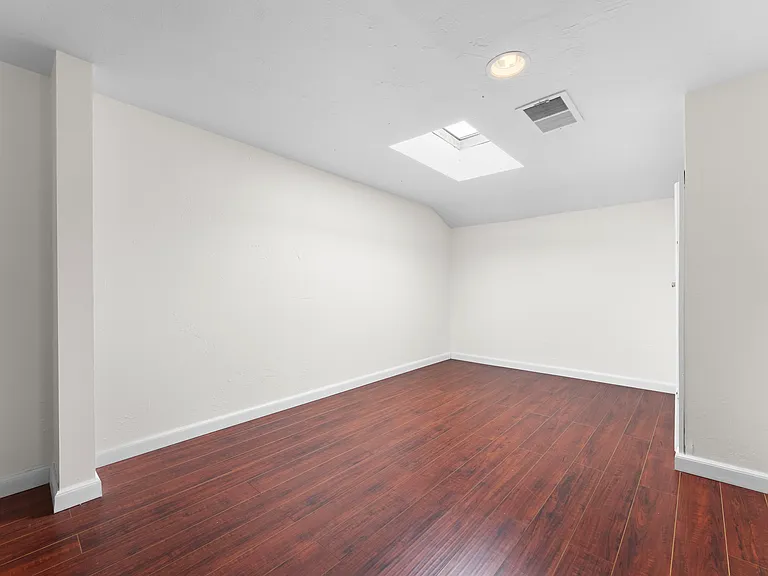 Ample storage room off from the upstairs bedroom with skylight