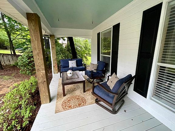 Ample room for seating out of the sun on the front porch.