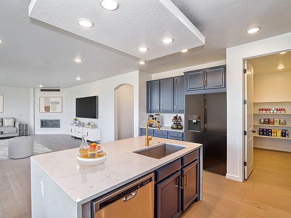 Elevate your kitchen design with the optional accent ceiling and waterfall edge island.