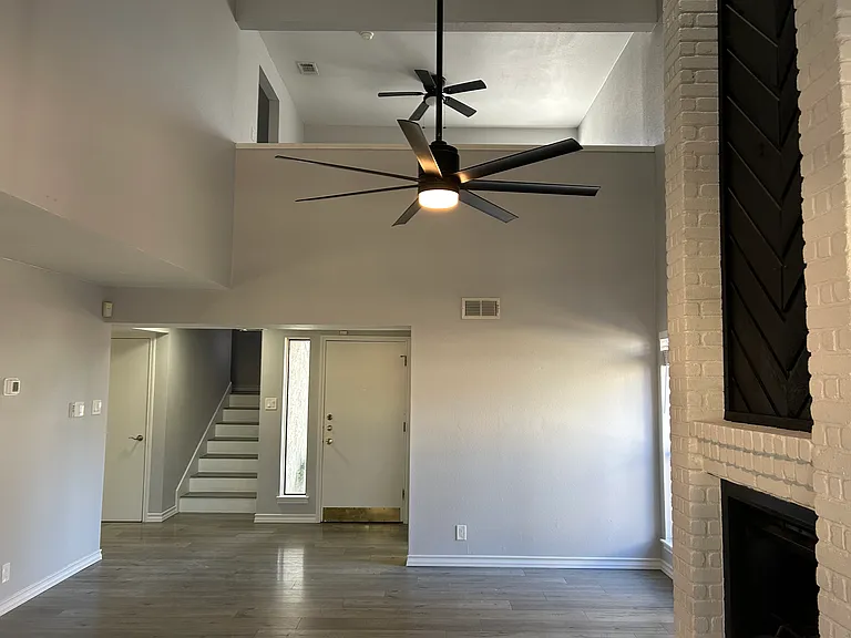 Back in the living room and if you look beyond the living ceiling fan you can see the loft area and we will take a look at the loft when we go upstairs. But lets look at the dining area.