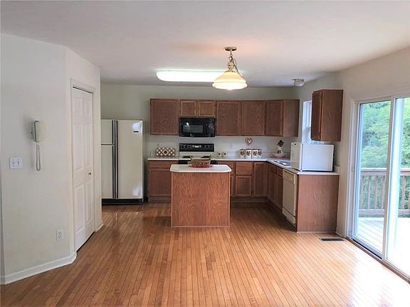 Kitchen. The kitchen features a breakfast nook with sliding glass door access to the back deck.