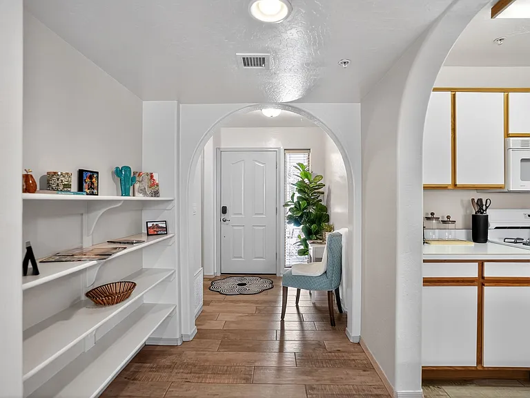 View from the living room to the front entry way and access to the kitchen, very open and easy accessible floor plan