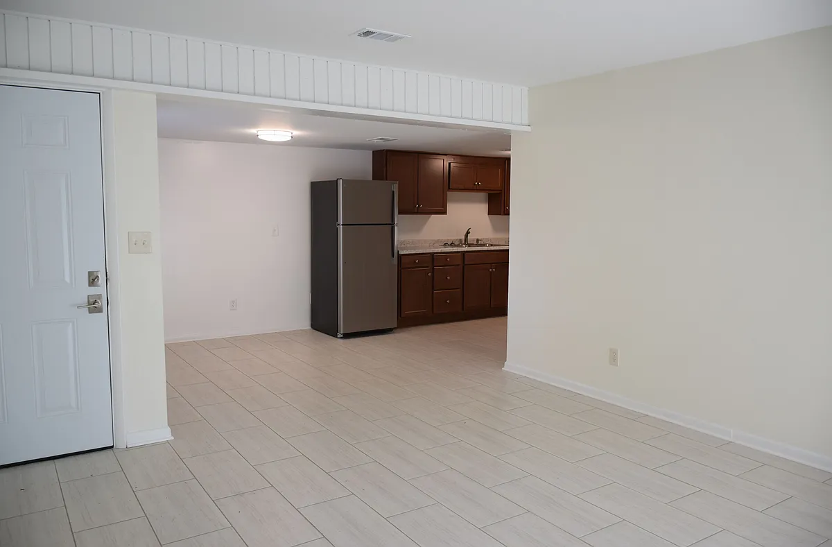 Living Room to Dining Area / Kitchen - Arboles Apartments