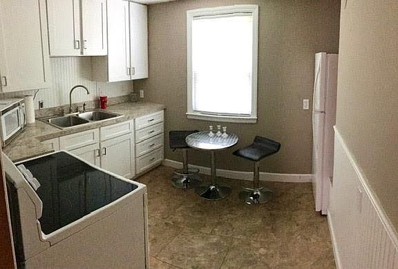 Kitchen with cafe table and chairs