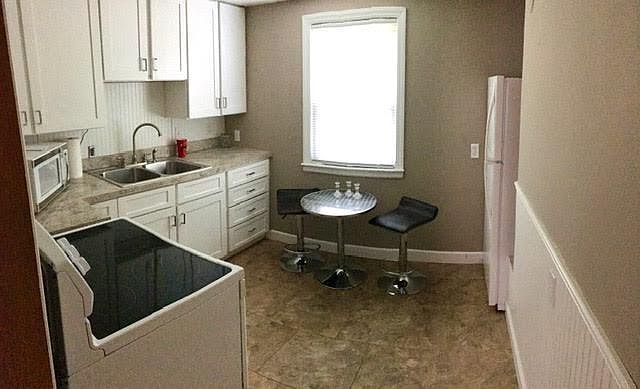 Kitchen with cafe table and chairs
