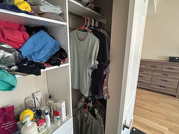 Closet space. The hanger space extends both ways from the centre console.