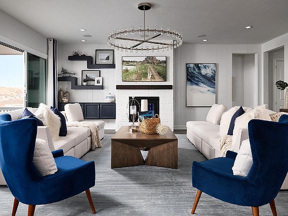 Great room featuring a gas fireplace and opening onto the rear patio