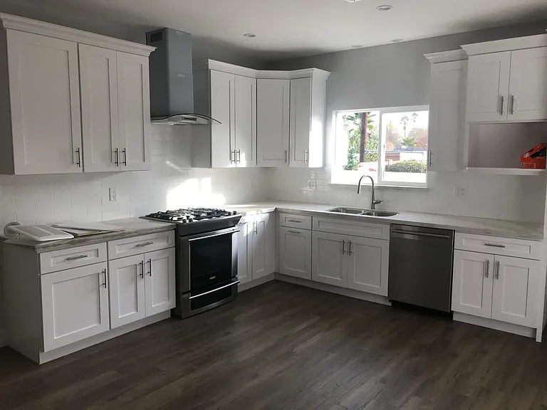 Large open kitchen. New cabinets and appliances with quartz counters