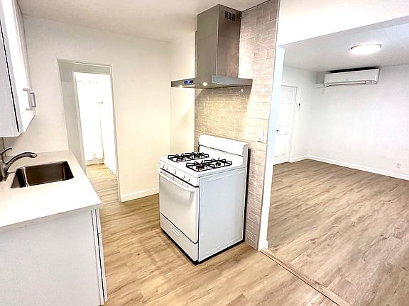 Kitchen eating area and living room