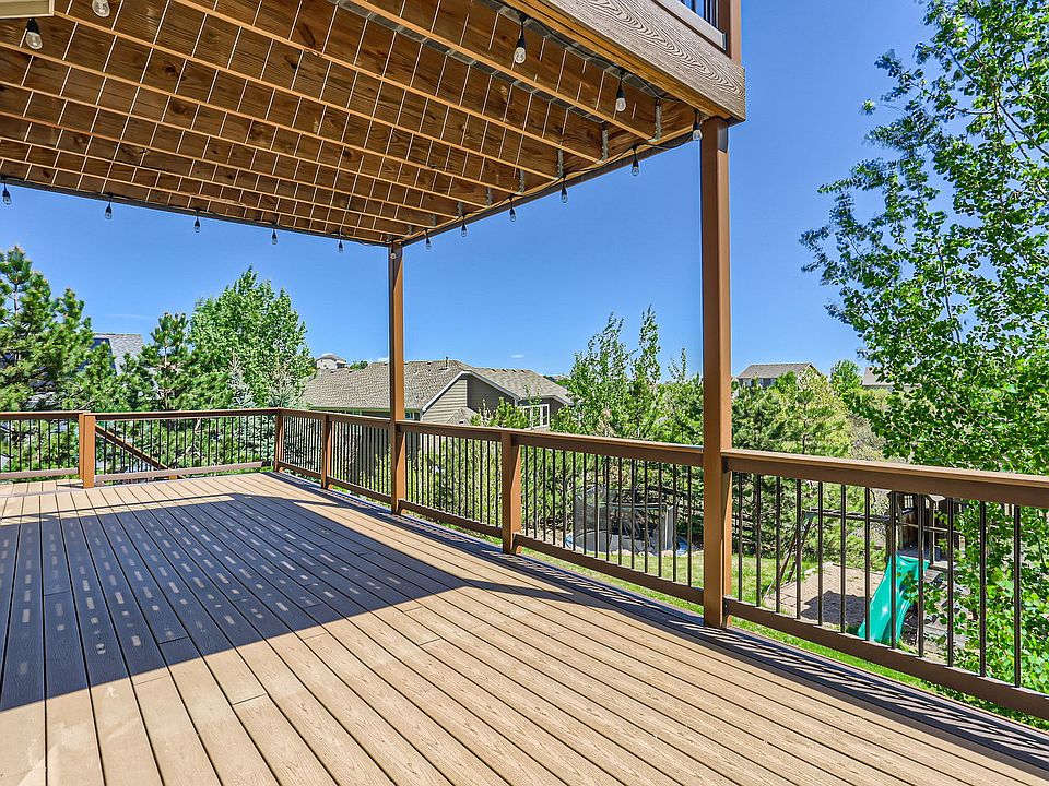 Deck off main floor living space and under balcony.